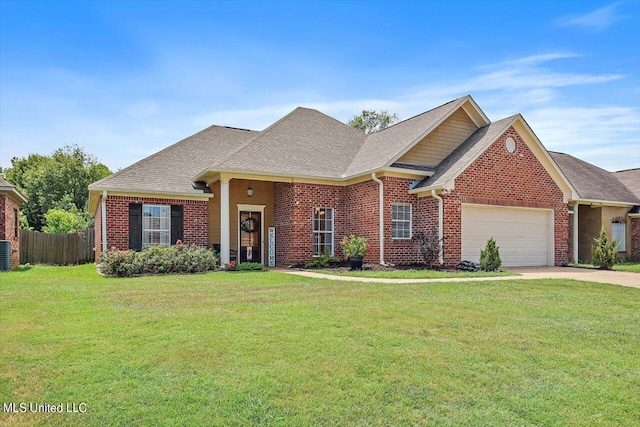 view of front of property with central AC, a front lawn, and a garage