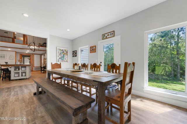 19640 Busby Rd, Vancleave, MS 39565 - dining area with light wood-type flooring, an inviting chandelier, recessed lighting, and a healthy amount of sunlight