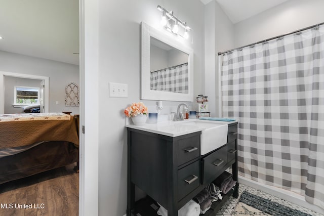 19640 Busby Rd, Vancleave, MS 39565 - full bathroom featuring a shower with curtain, wood finished floors, ensuite bath, and vanity