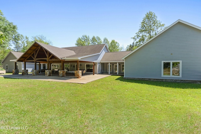 19640 Busby Rd, Vancleave, MS 39565 - back of property featuring a lawn, roof with shingles, and a patio