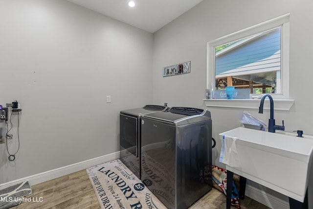 19640 Busby Rd, Vancleave, MS 39565 - laundry room featuring wood finished floors, a sink, washer and dryer, baseboards, and laundry area