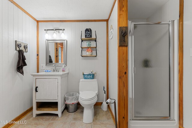 19640 Busby Rd, Vancleave, MS 39565 - bathroom featuring toilet, tile patterned flooring, a shower stall, wooden walls, and vanity