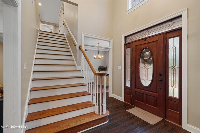 32 Cambrooke, Hattiesburg, MS 39402 - foyer featuring stairs, dark wood-type flooring, plenty of natural light, baseboards, and a towering ceiling