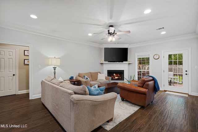 32 Cambrooke, Hattiesburg, MS 39402 - living area featuring dark wood-type flooring, ceiling fan, a warm lit fireplace, baseboards, and recessed lighting
