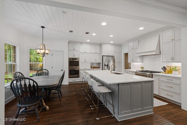 32 Cambrooke, Hattiesburg, MS 39402 - kitchen with appliances with stainless steel finishes, custom exhaust hood, a sink, recessed lighting, and a chandelier