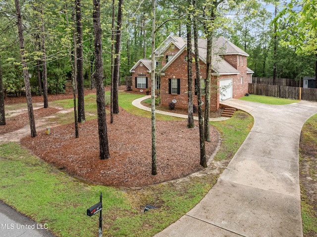 32 Cambrooke, Hattiesburg, MS 39402 - view of front of house with driveway, brick siding, and a garage