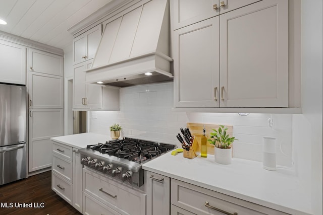 32 Cambrooke, Hattiesburg, MS 39402 - kitchen featuring custom range hood, stainless steel appliances, light countertops, tasteful backsplash, and recessed lighting