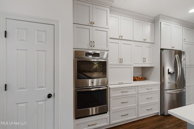32 Cambrooke, Hattiesburg, MS 39402 - kitchen featuring stainless steel appliances, light countertops, dark wood-style floors, and white cabinets