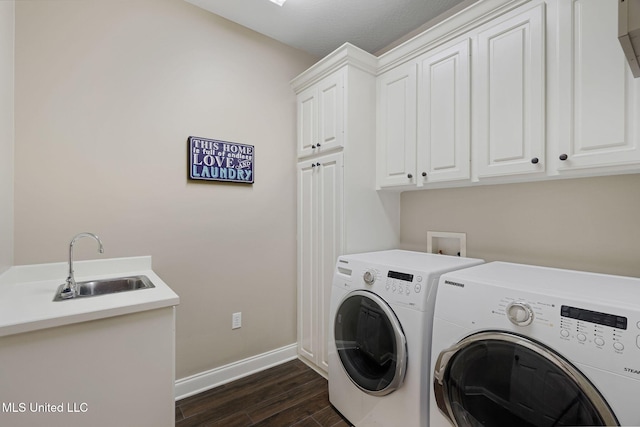 32 Cambrooke, Hattiesburg, MS 39402 - laundry area featuring cabinet space, washer and clothes dryer, baseboards, and dark wood-style floors
