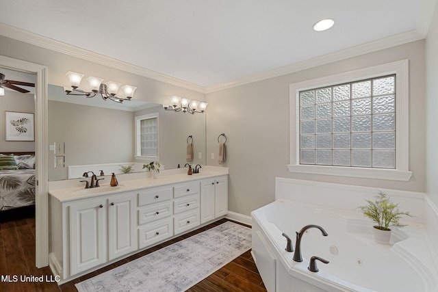 32 Cambrooke, Hattiesburg, MS 39402 - bathroom with wood finished floors, double vanity, a whirlpool tub, ensuite bathroom, and a chandelier