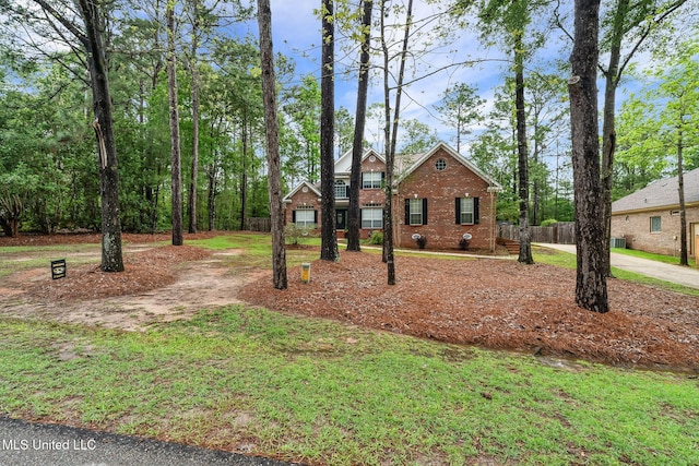 32 Cambrooke, Hattiesburg, MS 39402 - view of front of house featuring brick siding, fence, and concrete driveway