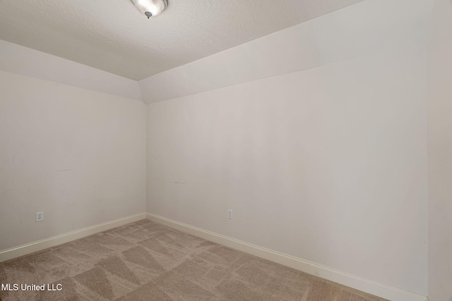 32 Cambrooke, Hattiesburg, MS 39402 - spare room featuring light colored carpet, baseboards, and lofted ceiling