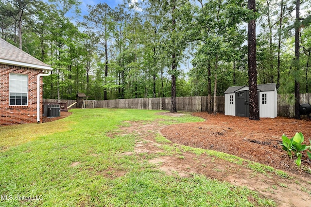 32 Cambrooke, Hattiesburg, MS 39402 - view of yard featuring cooling unit, a storage unit, an outbuilding, and view of scattered trees