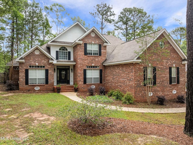 32 Cambrooke, Hattiesburg, MS 39402 - traditional-style home with a shingled roof, brick siding, and a front yard