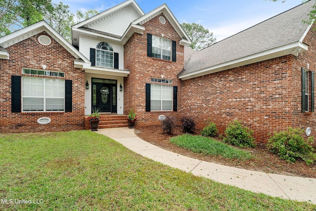 32 Cambrooke, Hattiesburg, MS 39402 - traditional-style house with a front lawn, brick siding, and a shingled roof