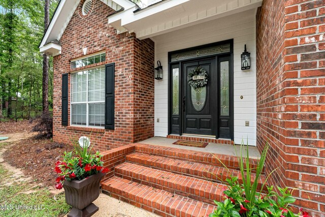 32 Cambrooke, Hattiesburg, MS 39402 - doorway to property featuring brick siding