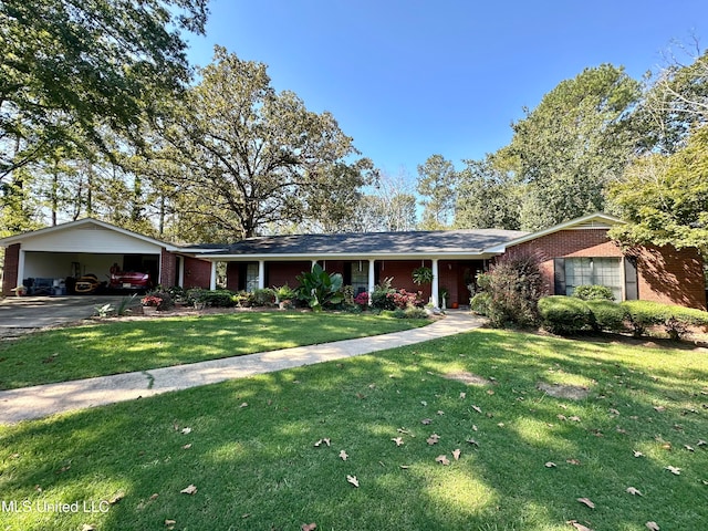 ranch-style house featuring a garage, a front lawn, and a carport