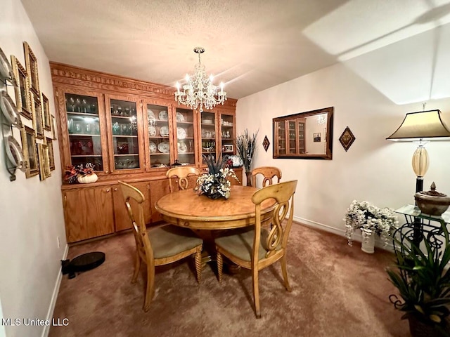 carpeted dining area featuring a chandelier