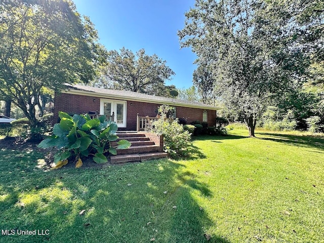 exterior space with a front yard