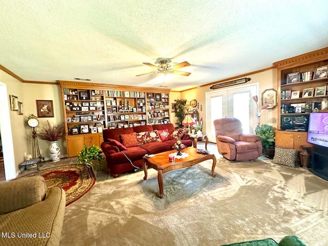 carpeted living room with crown molding, a textured ceiling, and ceiling fan