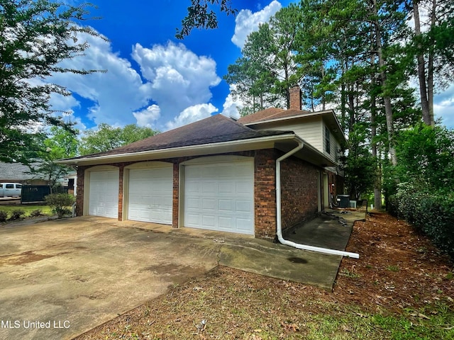 view of side of home with a garage