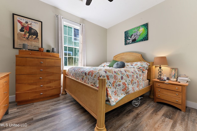 bedroom featuring dark hardwood / wood-style flooring and ceiling fan