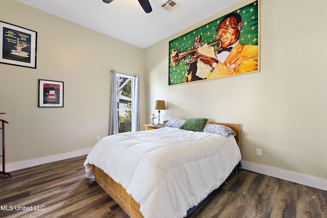 bedroom with dark hardwood / wood-style floors and ceiling fan