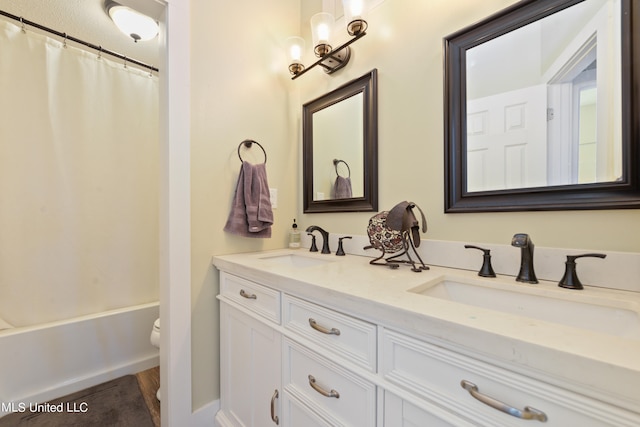 full bathroom with vanity, toilet, and shower / tub combo