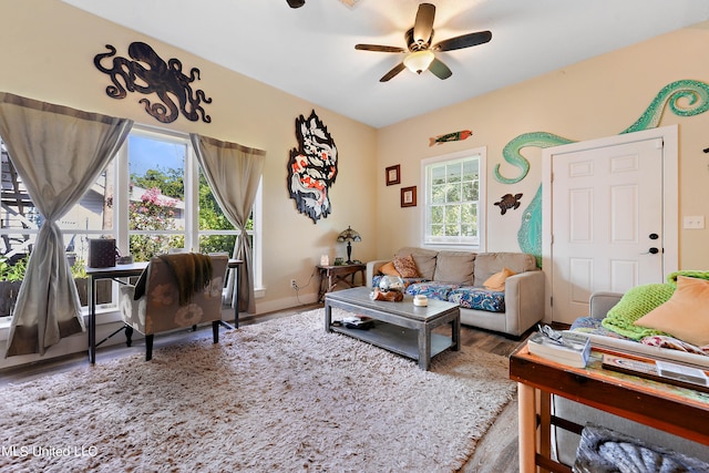 living room with a healthy amount of sunlight, hardwood / wood-style flooring, and ceiling fan