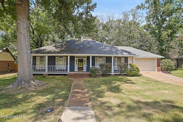 ranch-style home with covered porch, a front lawn, and a garage