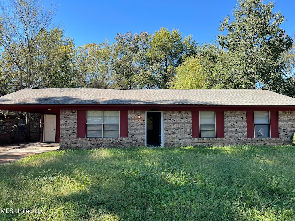 ranch-style home with a carport