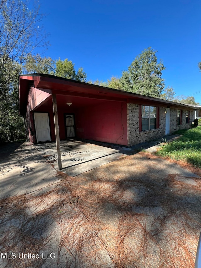 exterior space featuring a carport