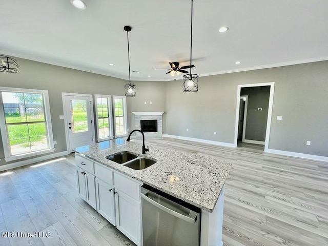 113 River Bend Ave, Vidalia, LA 71373 - kitchen with an island with sink, open floor plan, stainless steel dishwasher, white cabinetry, and a sink