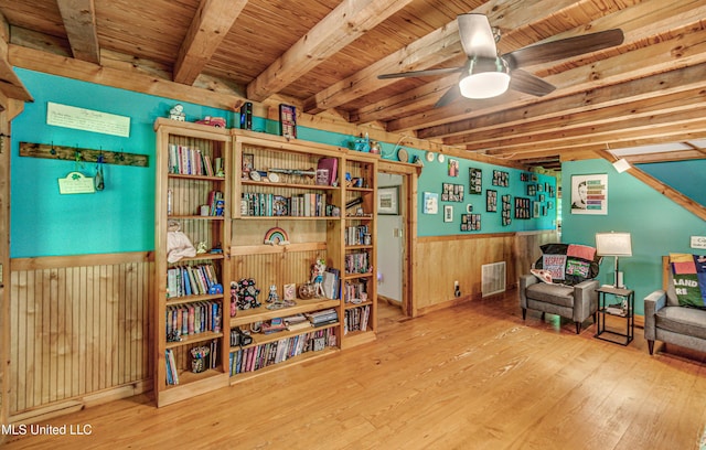 106 Mcwilliams Dr, Terry, MS 39170 - sitting room with wood-type flooring, a ceiling fan, beamed ceiling, wood walls, and wooden ceiling