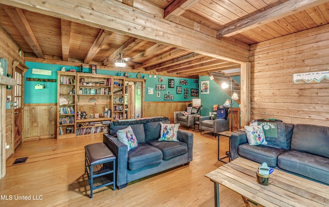 106 Mcwilliams Dr, Terry, MS 39170 - living room featuring wooden ceiling, wood walls, beam ceiling, wood finished floors, and a ceiling fan