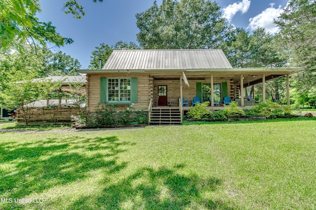 106 Mcwilliams Dr, Terry, MS 39170 - log home featuring log exterior, a porch, a front yard, and metal roof