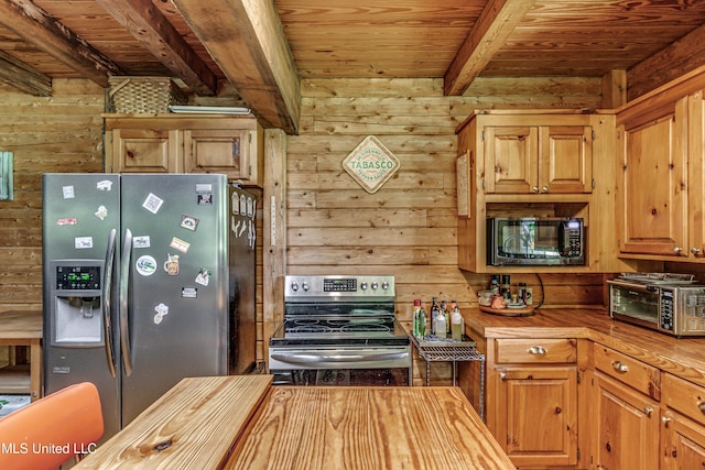 106 Mcwilliams Dr, Terry, MS 39170 - kitchen with appliances with stainless steel finishes, wooden ceiling, beam ceiling, butcher block countertops, and wood walls