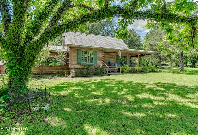 106 Mcwilliams Dr, Terry, MS 39170 - cabin with a porch, a front yard, metal roof, and log exterior