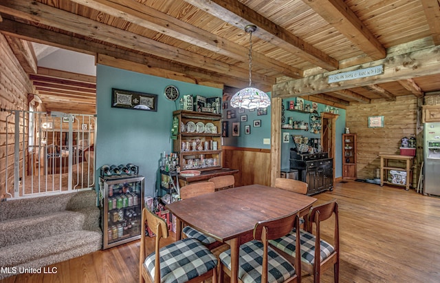 106 Mcwilliams Dr, Terry, MS 39170 - dining room with beamed ceiling, wooden ceiling, hardwood / wood-style flooring, wooden walls, and wainscoting