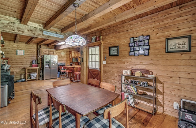 106 Mcwilliams Dr, Terry, MS 39170 - dining space with wood ceiling, beamed ceiling, light wood-type flooring, and wooden walls