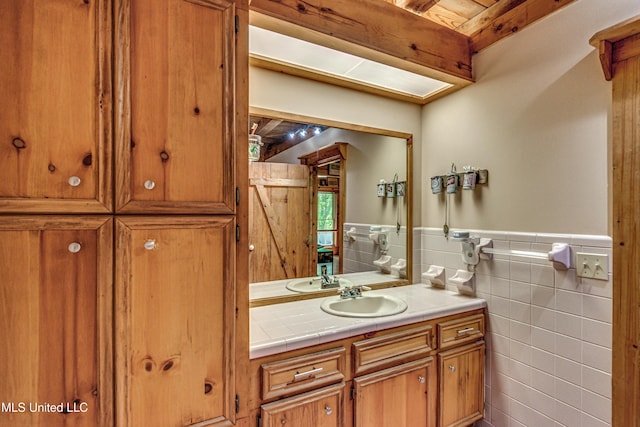 106 Mcwilliams Dr, Terry, MS 39170 - bathroom with tile walls, a wainscoted wall, and vanity