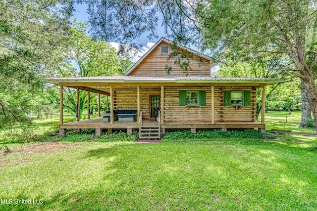 106 Mcwilliams Dr, Terry, MS 39170 - view of front of home with a front yard, metal roof, and log siding