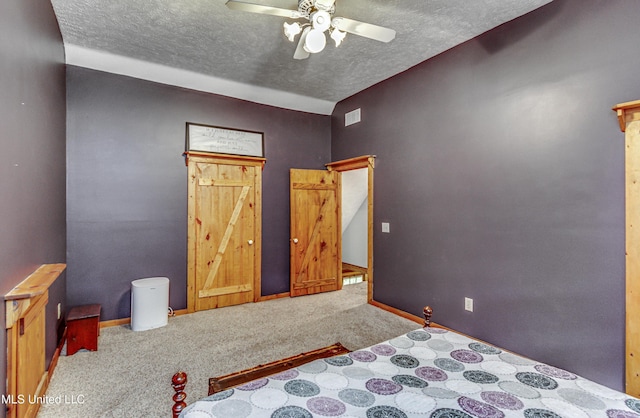 106 Mcwilliams Dr, Terry, MS 39170 - unfurnished bedroom with carpet floors, a textured ceiling, baseboards, and ceiling fan