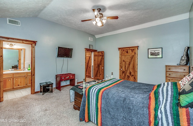 106 Mcwilliams Dr, Terry, MS 39170 - bedroom featuring lofted ceiling, light carpet, a textured ceiling, a sink, and a ceiling fan