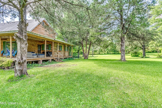 106 Mcwilliams Dr, Terry, MS 39170 - view of grassy yard with a porch