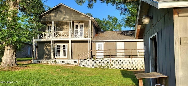 904 E Lakeshore Dr, Carriere, MS 39426 - rear view of property with a balcony, a yard, and french doors