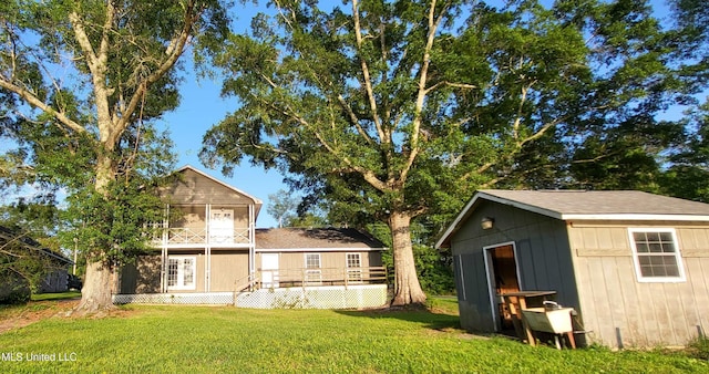 904 E Lakeshore Dr, Carriere, MS 39426 - view of grassy yard with a balcony and an outdoor structure