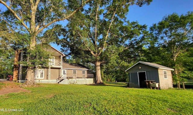 904 E Lakeshore Dr, Carriere, MS 39426 - view of green lawn with a storage shed and an outdoor structure