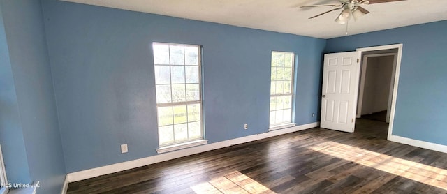 904 E Lakeshore Dr, Carriere, MS 39426 - unfurnished bedroom with baseboards, dark wood-style floors, and ceiling fan