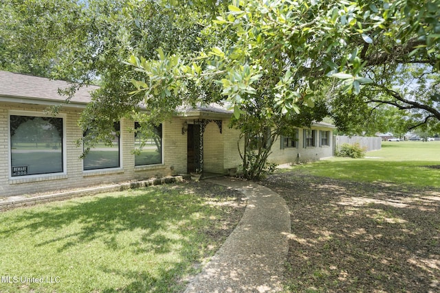 5539 Gates Ave, Long Beach, MS 39560 - view of front of property with brick siding and roof with shingles